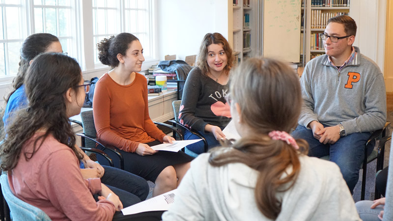 Group of young adults having a discussion